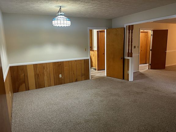 Multipurpose space that adjoins living room and next to the kitchen. Can be used as kid's play area or home office space.