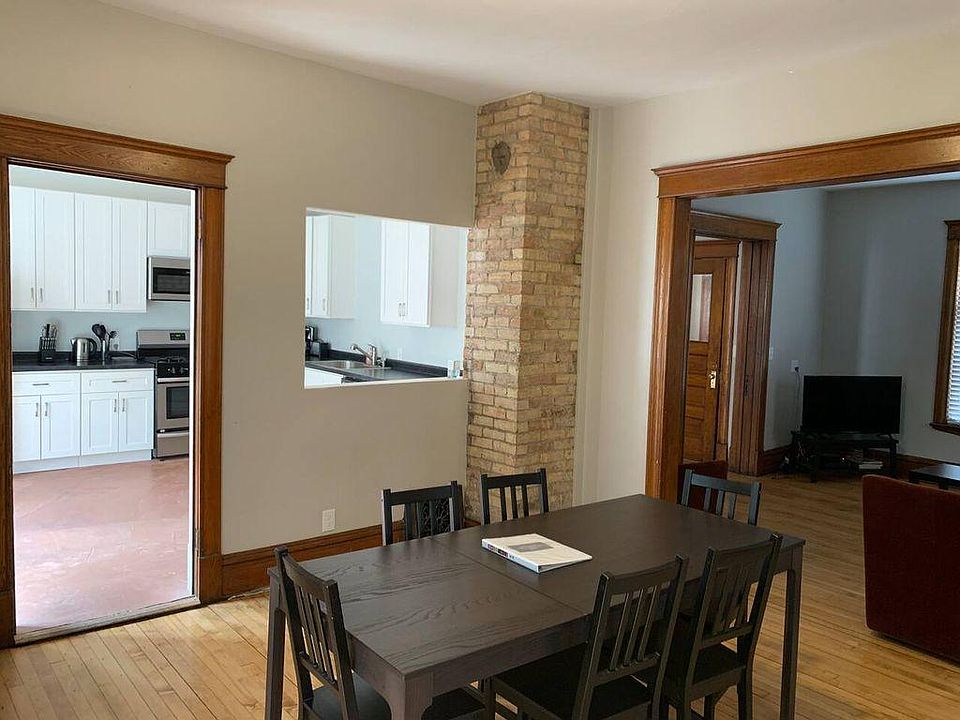 Dining room looking into kitchen and living room.