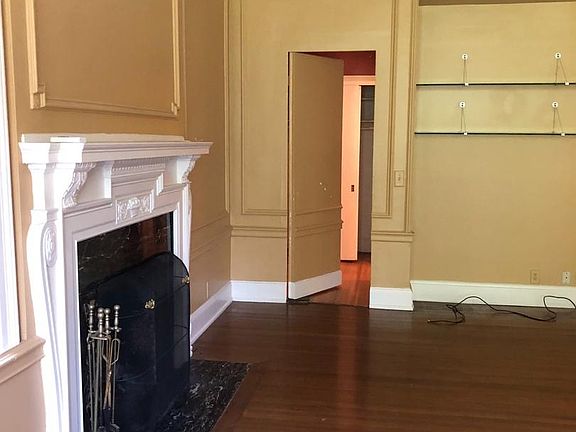 Living room with secret door to bedrooms and bathrooms