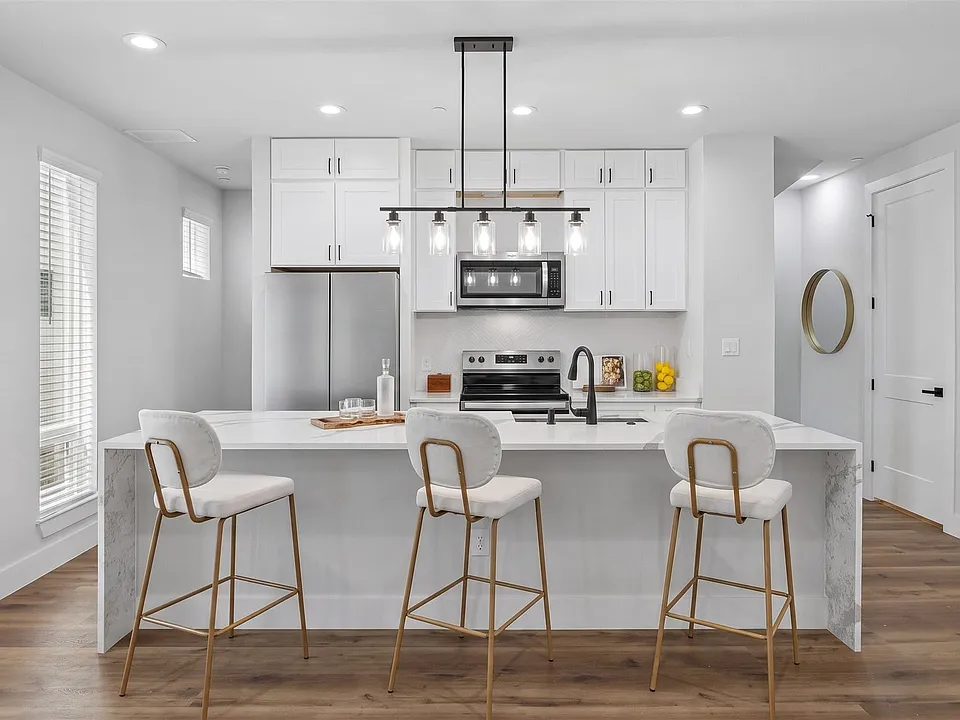 microwave and oven are virtually staged. comparable stainless steel appliances will be installed prior to move in.