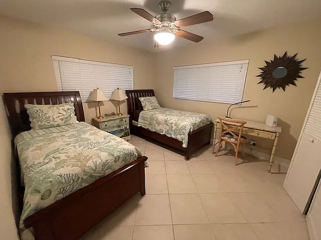 Guest room has 2 twin beds and a desk for any little items that need some tending to while away. The internet connection is as speedy as it gets in The Keys!