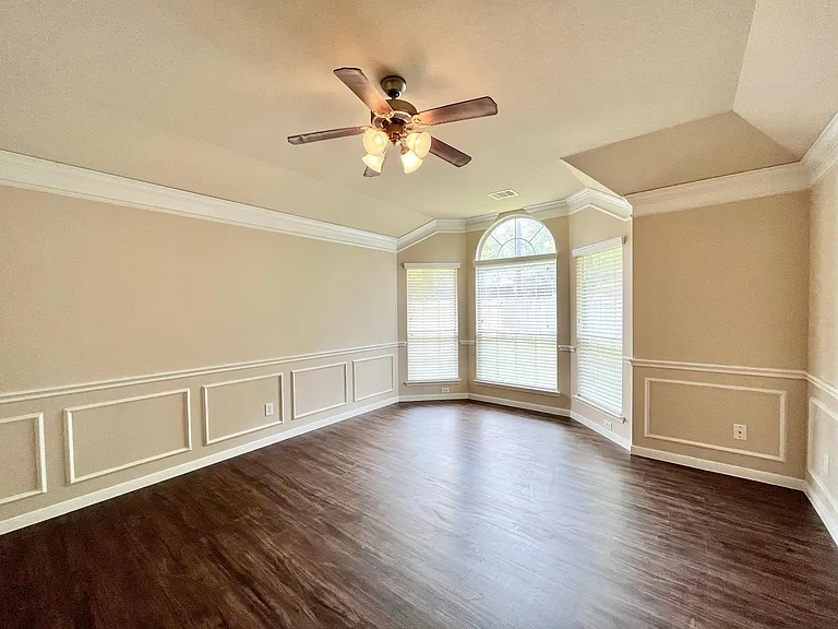master bedroom with bay window