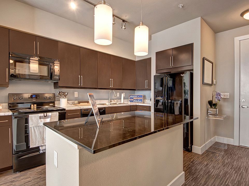 Granite Kitchen Island with Pendant Lighting