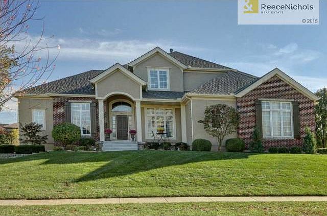 Magnificent 1.5 story, Koheler home on beautiful lot backing to