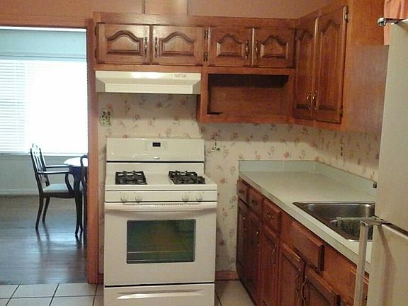 Kitchen..tile flooring..Gas Stove & refrigerator to remain