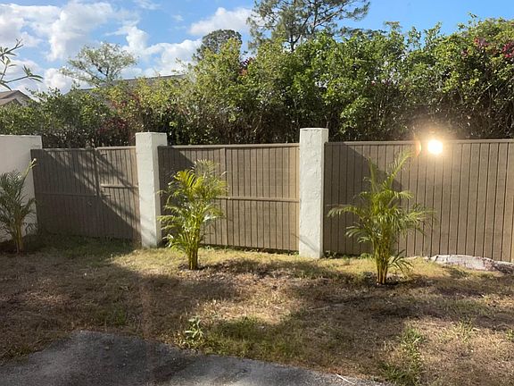 Fully fenced backyard with gate