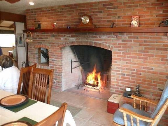 Fireplace in the kitchen breakfast area.