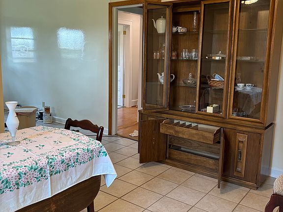 china closet stays with house with space for silverware, dining table optional