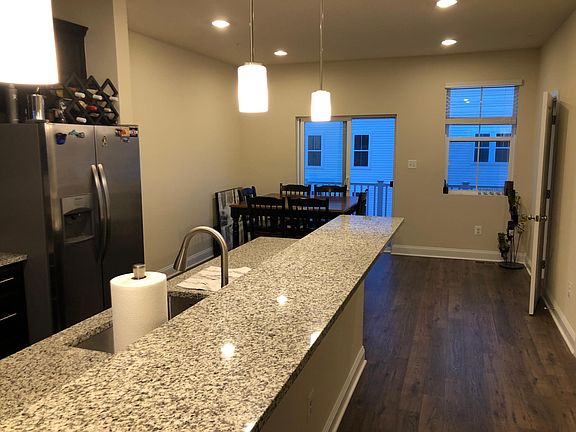 Upgraded kitchen with granite countertop and stainless steel appliances