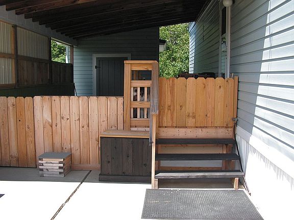 Back covered entry w/deck.