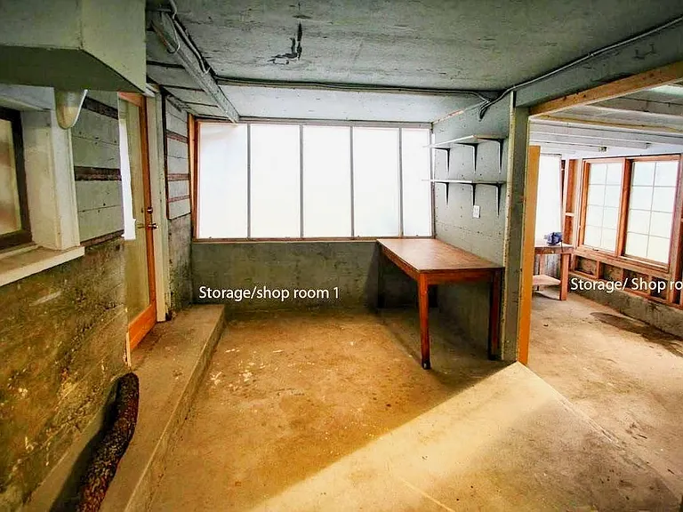 Enclosed Storage /Shop space (unheated) daylight basement. (shop space #1 and shop space #2)