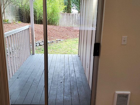 Back private deck and partial view of private back yard.