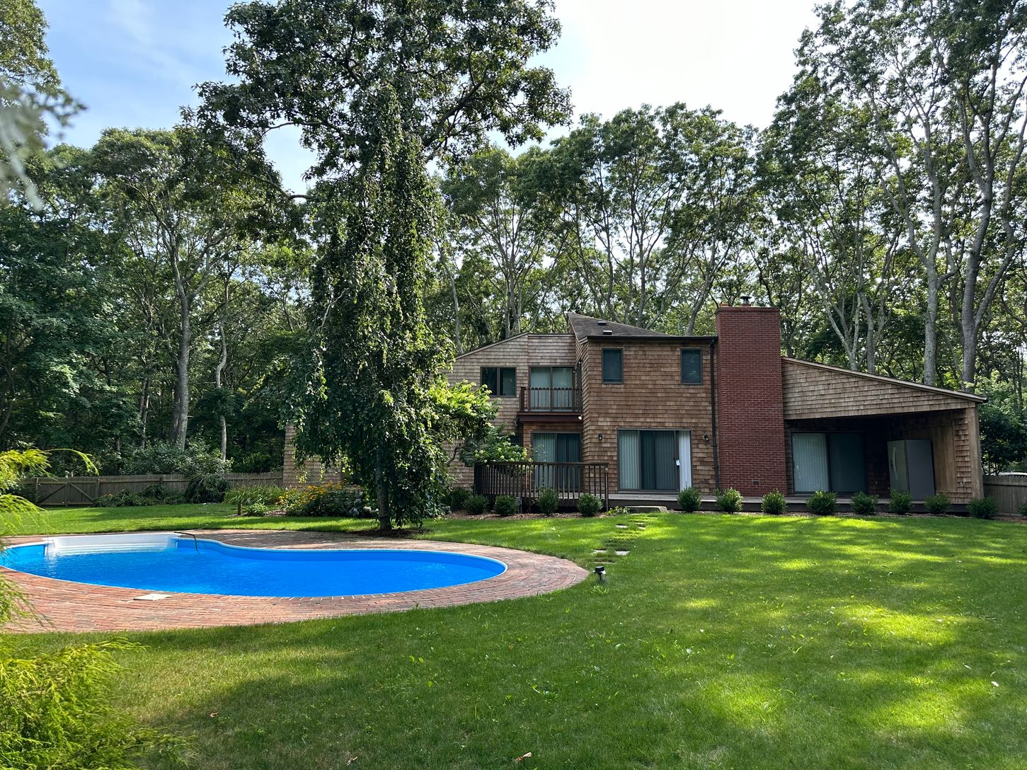 VIEW FROM BACKYARD LOOKING AT BACK OF HOUSE