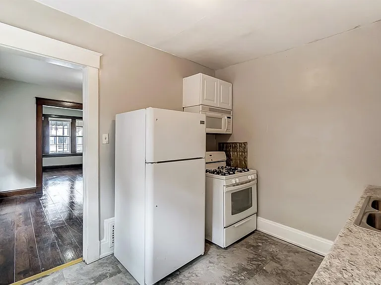 Kitchen refrigerator, microwave and stove