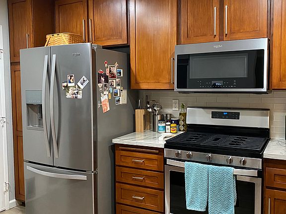 Large refrigerator, gas oven