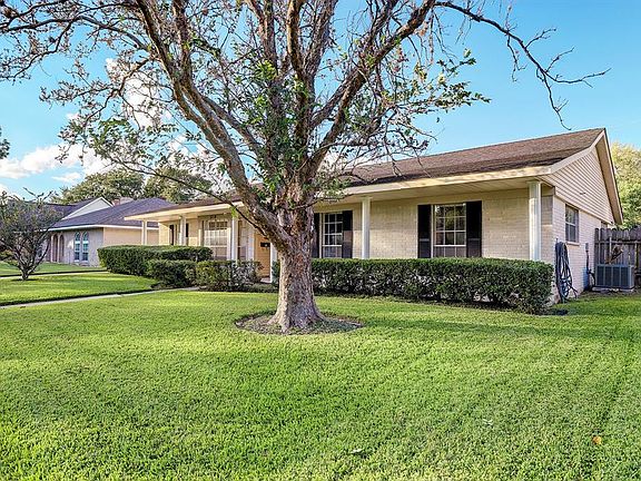 The curb appeal is outstanding with a large Maple tree standing over the front yard, mature landscaping, and a delightful covered front porch.