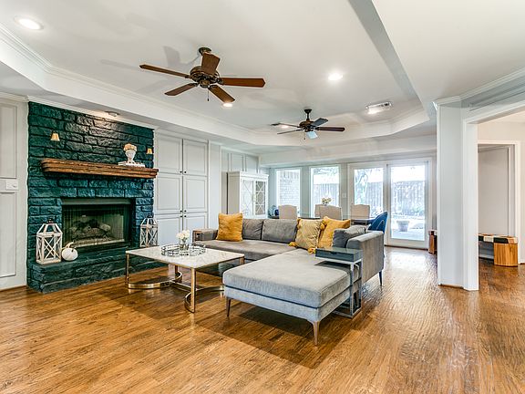 The fireplace is actually a dark grey color, eventhough it appears greenish in this photo.