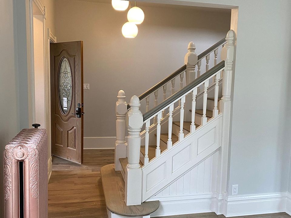 From living room towards front door and alcove. Front door has a keyless PIN lock and one sided deadbolt. No keys required! Note: Wide angle camera shot which distorts size and perspective.