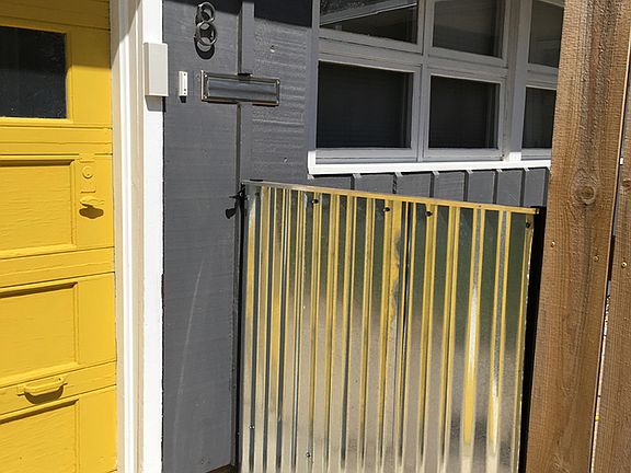 Entry gate with doorbell.
