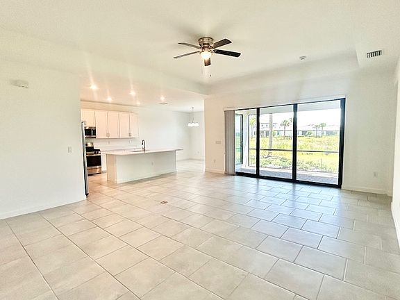 Panoramic view of Kitchen, DR, Greatroom, and Lanai