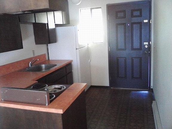 FRONT ENTRANCE AND KITCHEN AREA