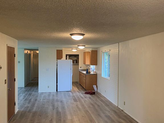 From the end of the family room looking towards the dining room and kitchen