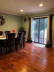dining area overlooking deck and woods
