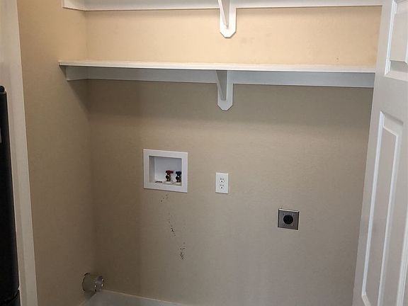 Utility Closet with Full-sized Washer and Dryer Connections