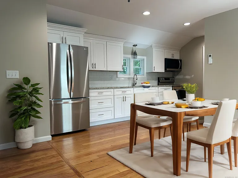 Open floor plan for kitchen, dining and living area. Virtually staged
