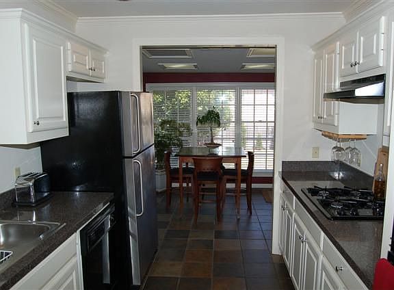 KITCHEN FEATURES SLATE CERAMIC TILE, GAS COOKTOP, & REPLACED APPLIANCES