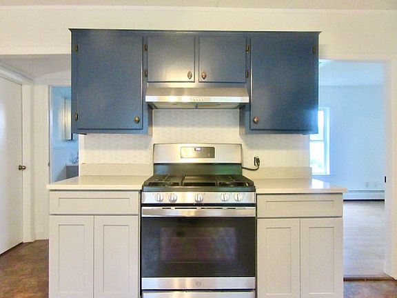 Kitchen - Updated cabinets & backsplash. Stainless steel appliances