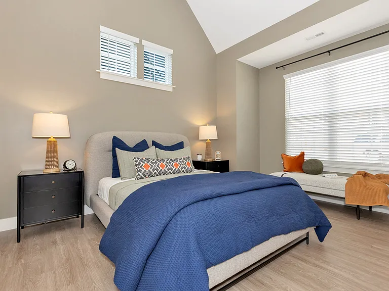 Bedroom with Vaulted Ceilings and Wood Style Flooring