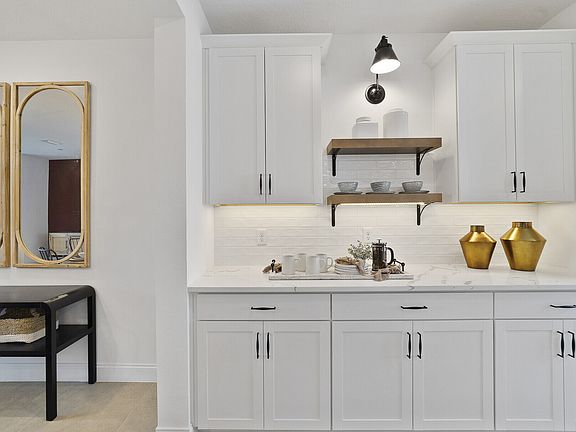Floating shelves with matte black lighting