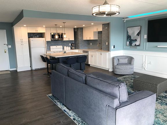Open concept living area. Two TVs mounted and ready!