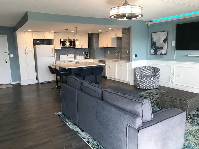 Open concept living area. Two TVs mounted and ready!