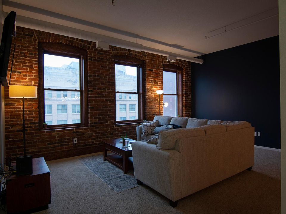 Exposed brick, high ceilings, large windows for lots of natural light
