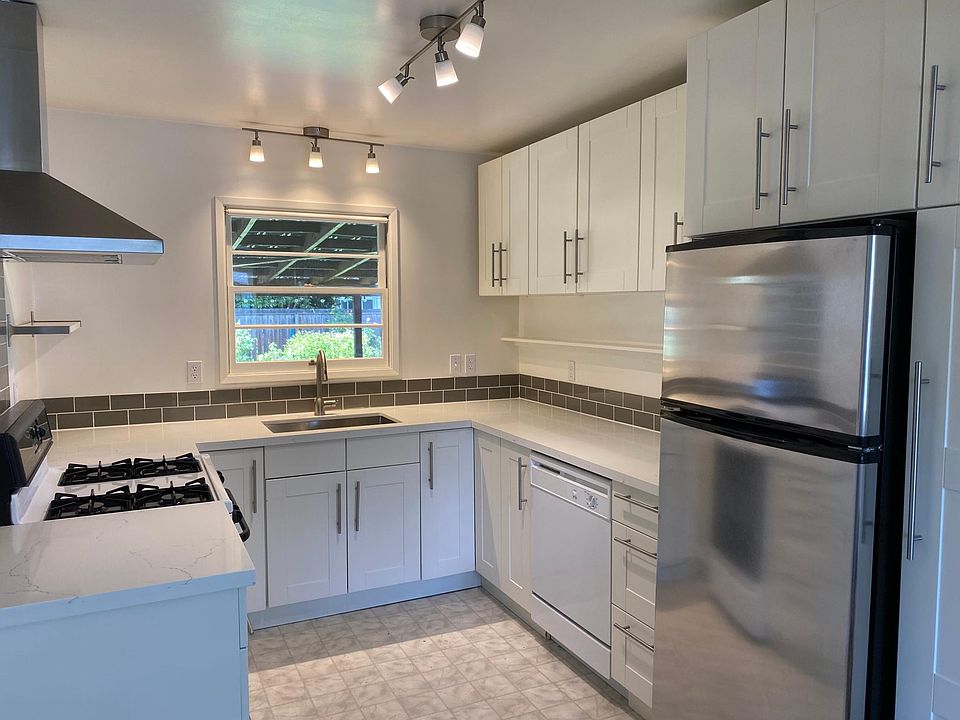 Modern kitchen with gas stove and dishwasher