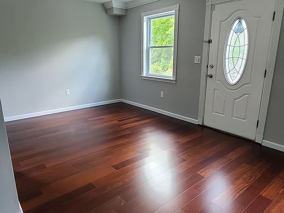 Spacious living / dining area; new hardwood floors throughout