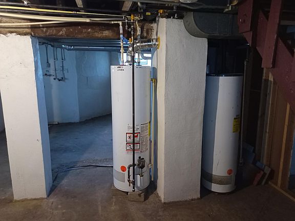 Water heaters and furnaces (not shown) in common basement area.