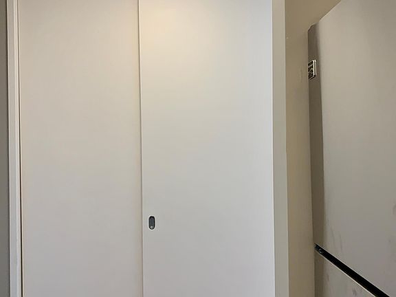 Hall Closet #1 across kitchen
