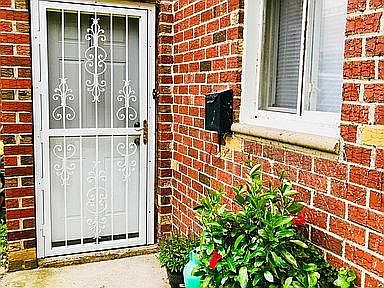 Front entrance with beautiful red brick exterior