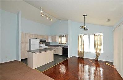 Eat-in kitchen with center island and breakfast bar with parquet flooring and tile flooring!!