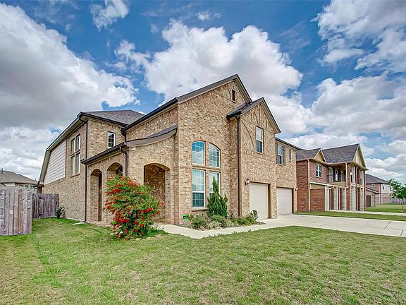 This Meritage home is so pretty with ample parking for your guests.