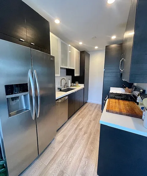 Galley kitchen with all stainless steel appliances