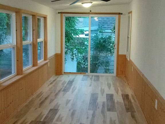 Rear sunroom with new floor freshpaint