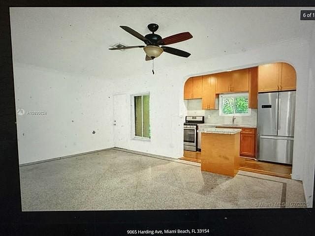 Very large great room with dining and living room adjacent to the kitchen