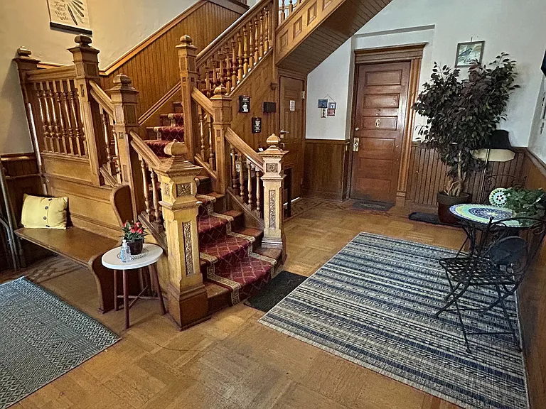 Experience timeless charm with this beautifully crafted wooden staircase, a perfect blend of elegance and warmth.