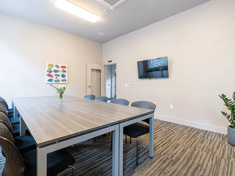 Conference Room with TV, desk and chairs