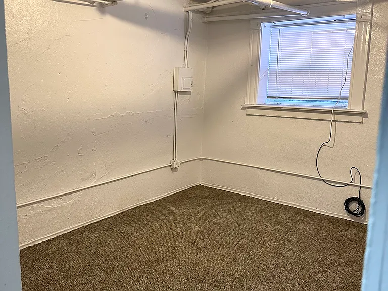 Discover this versatile basement room, perfect for creating a comfortable living space. Discover this versatile basement room, perfect for creating a comfortable living space.