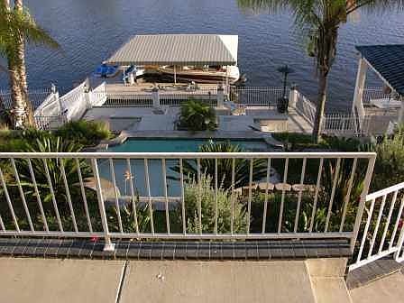 View of backyward, lake & dock